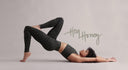 Hey Honey model in leopard print leggings and matching sports bra doing a bridge pose.